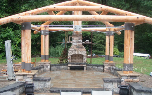 The Bungalow custom log gazebo. Construction photo of the logs and stone